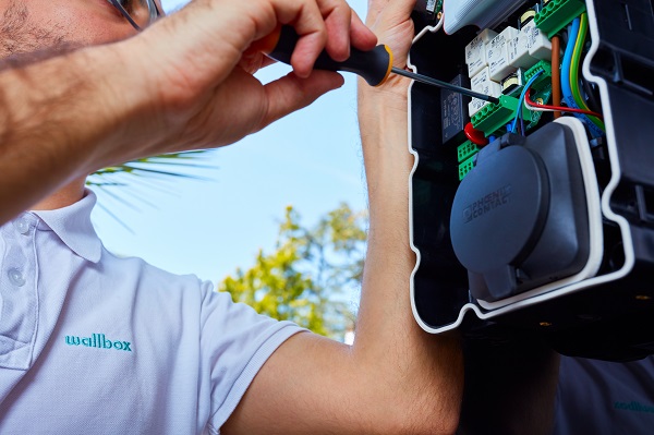 specialized and certified electrician installing an EV charger